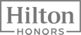 The image shows the Hilton Honors logo, which is part of the Hilton hotel chain's loyalty program.